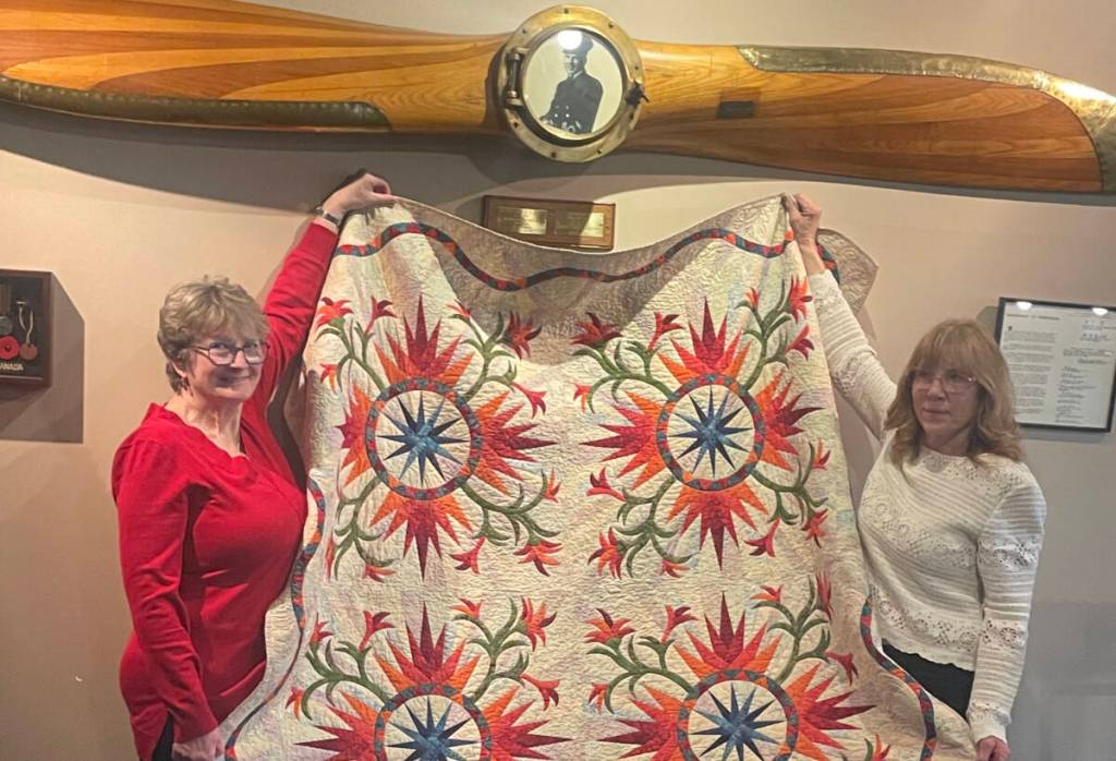 Cindy Postnikoff of Military Ames presents a Quilt of Valour to Sgt. Marsha Perry Ret'd. (Military Ames/Submitted).