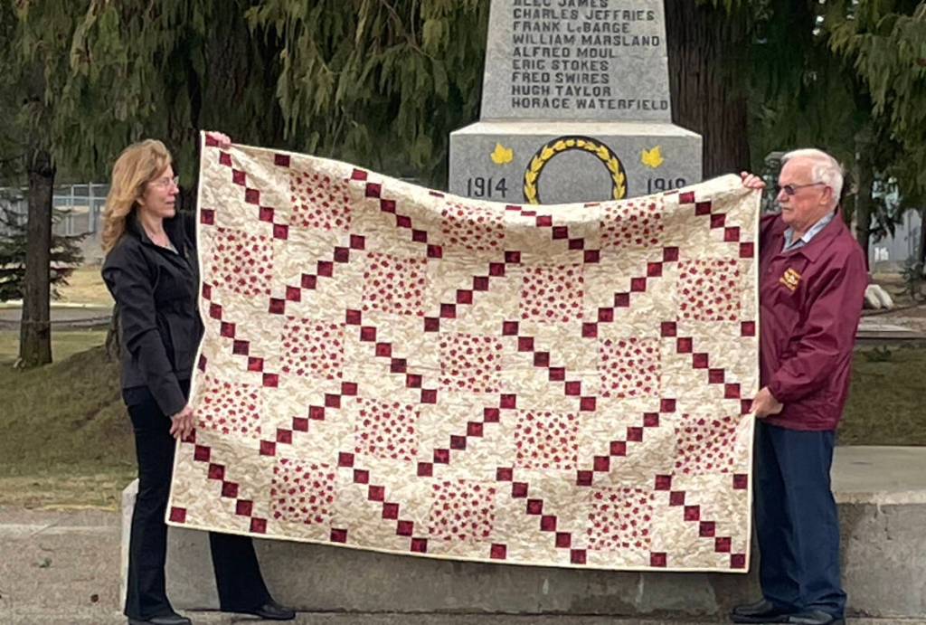 Cindy Postnikoff of Military Ames presents Cpl. H.P. Truax Ret&rsquo;d with a Quilt of Valour. (Military Ames/Submitted).